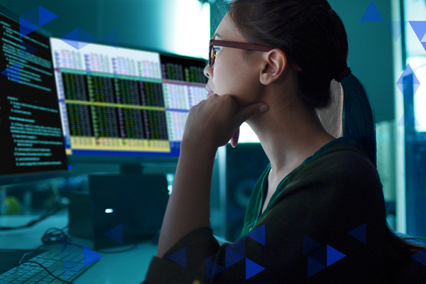 A woman looking at data on the screen