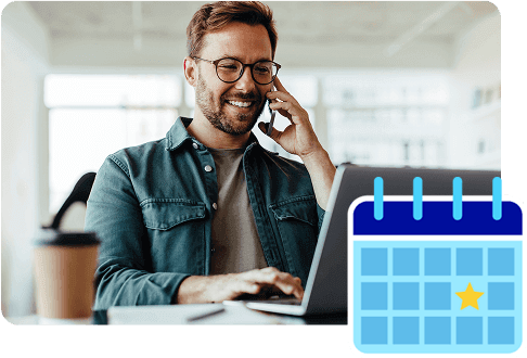 happy man at laptop with calender