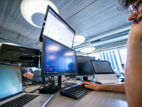 Startups are using big data  - man witn multiple screens